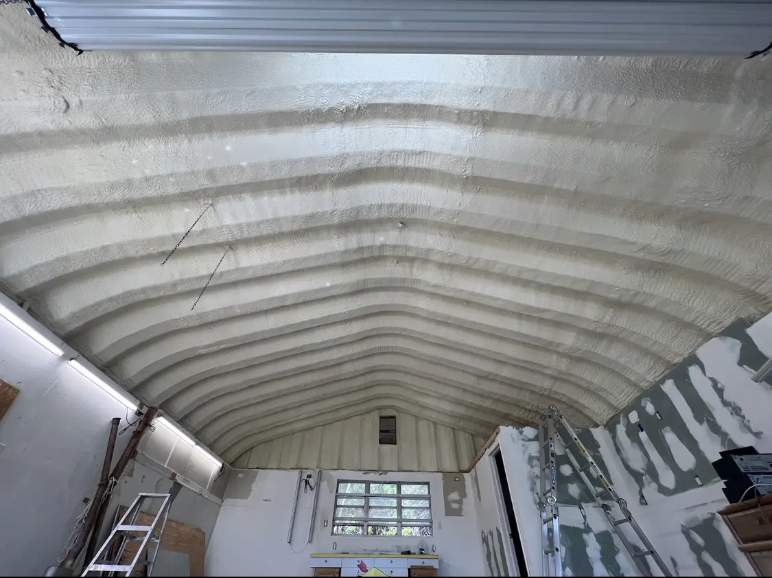 Spray polyurethane foam applied to the underside of a metal roof deck in Ballwin